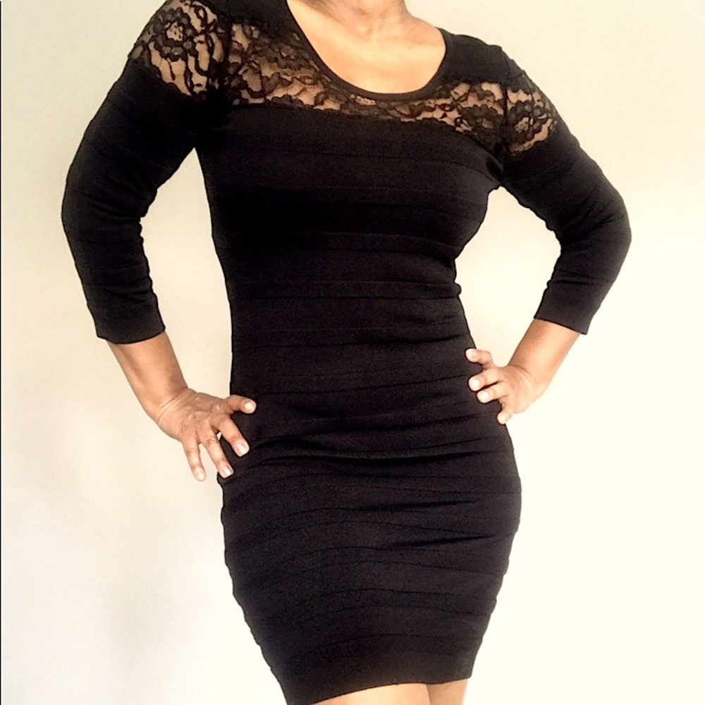 Fitted black dress with lace inlay